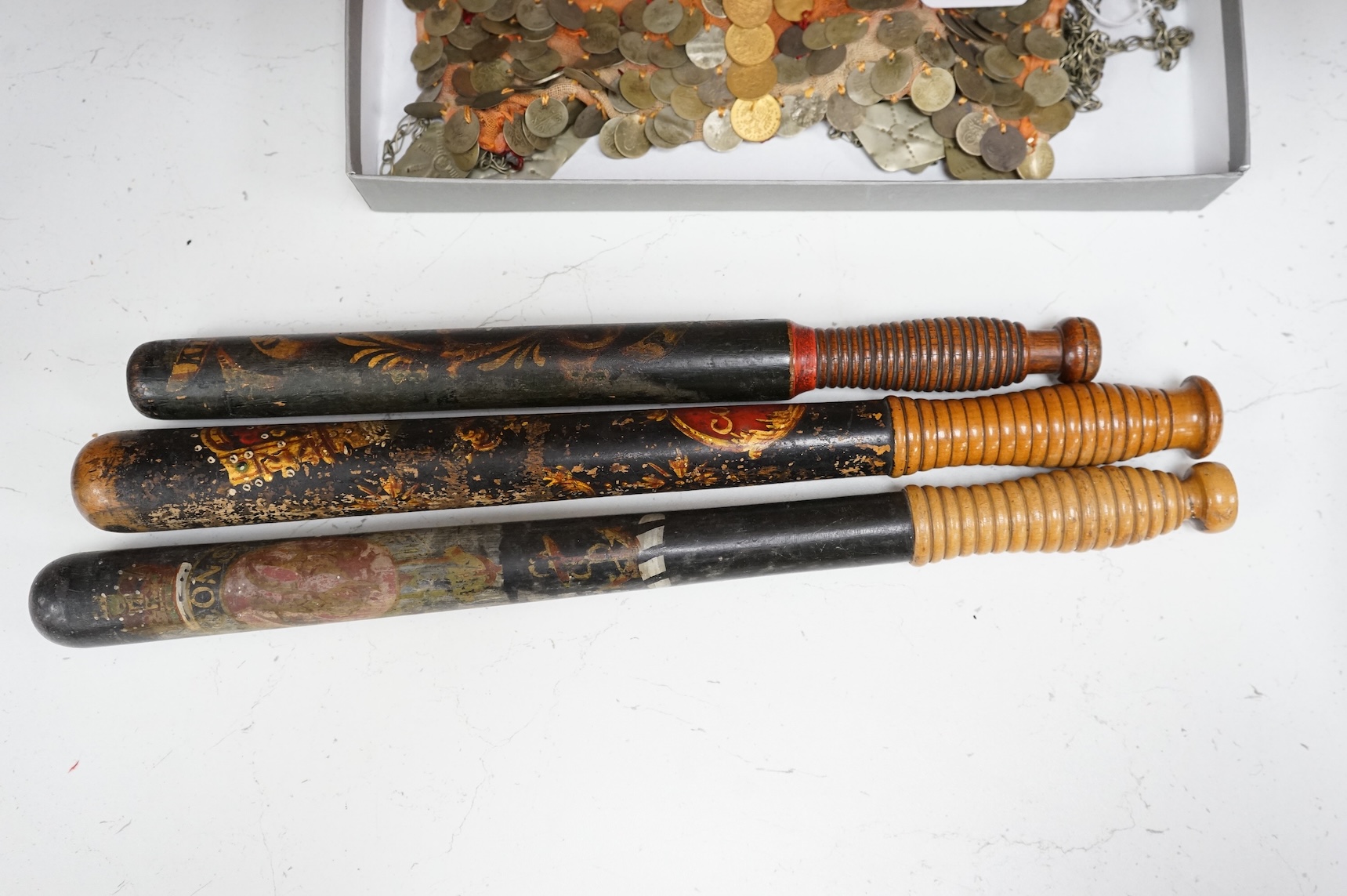 A Victorian Scottish Special Constable’s turned and painted wood truncheon, and two other Victorian Police truncheons, largest 46cm in length (3)